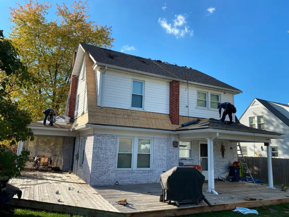 The crew working on the back roof of Sean's house